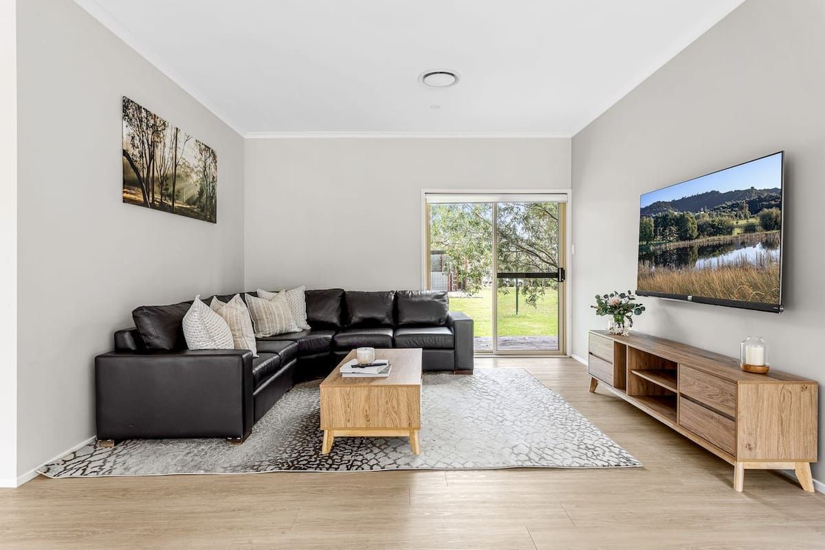 Outdoor fire pit area with seating at Jervis Bay Coastal Farm Retreat